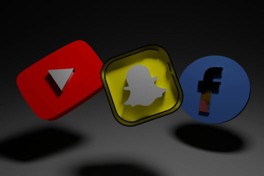 a group of three different colored objects on a black background